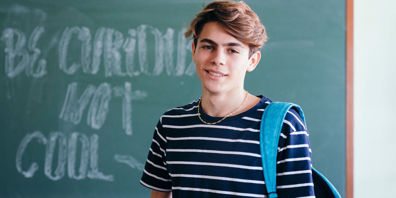 A smiling teenage boy | Source: Freepik