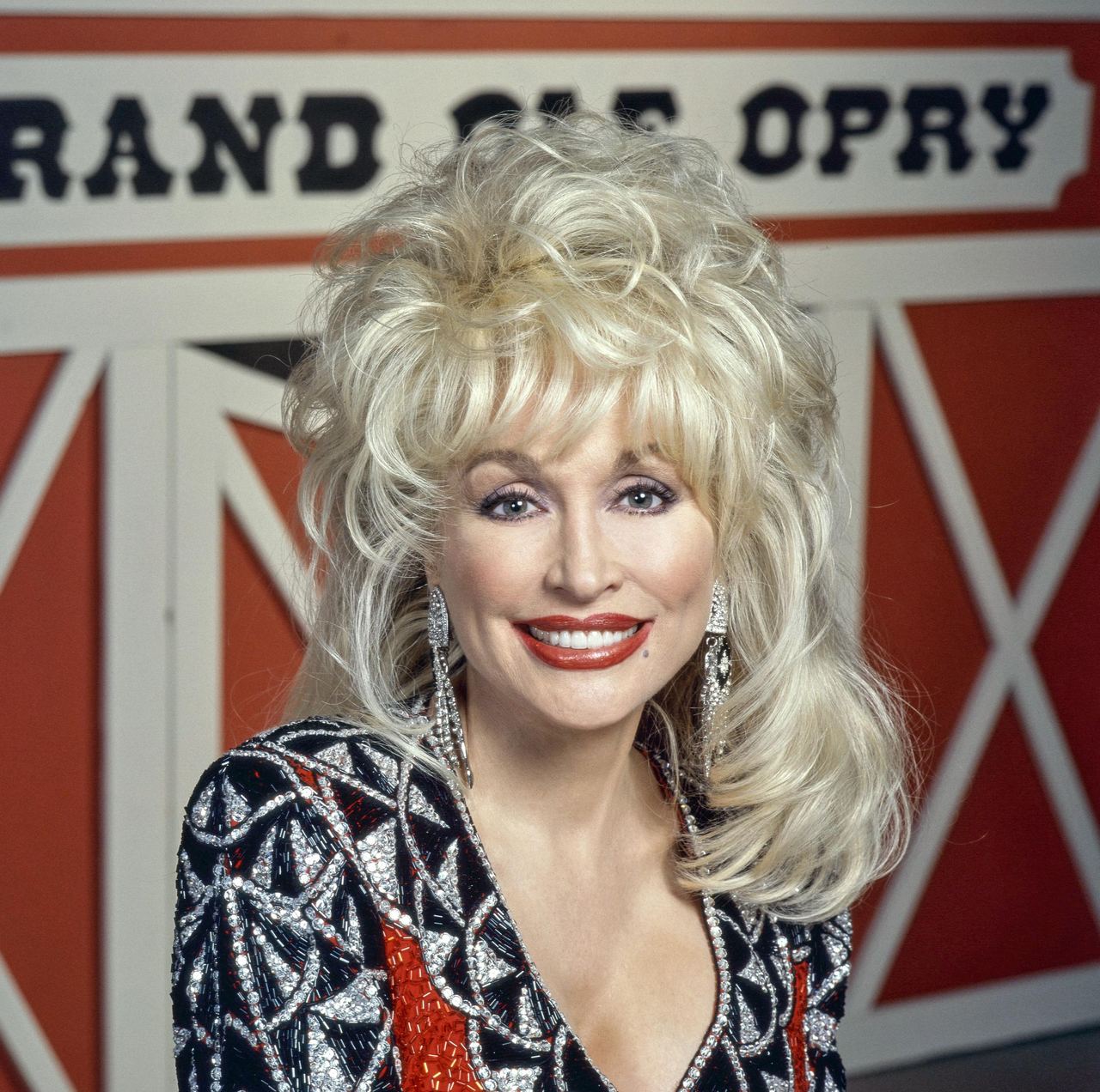Dolly Parton attends a public appearance in a glamorous ensemble as she reflects on how motherhood might have changed the course of her life and career. She later said she would have stayed home with her children and worried about them, reinforcing why she had no regrets about the path she ultimately followed. | Source: Getty Images