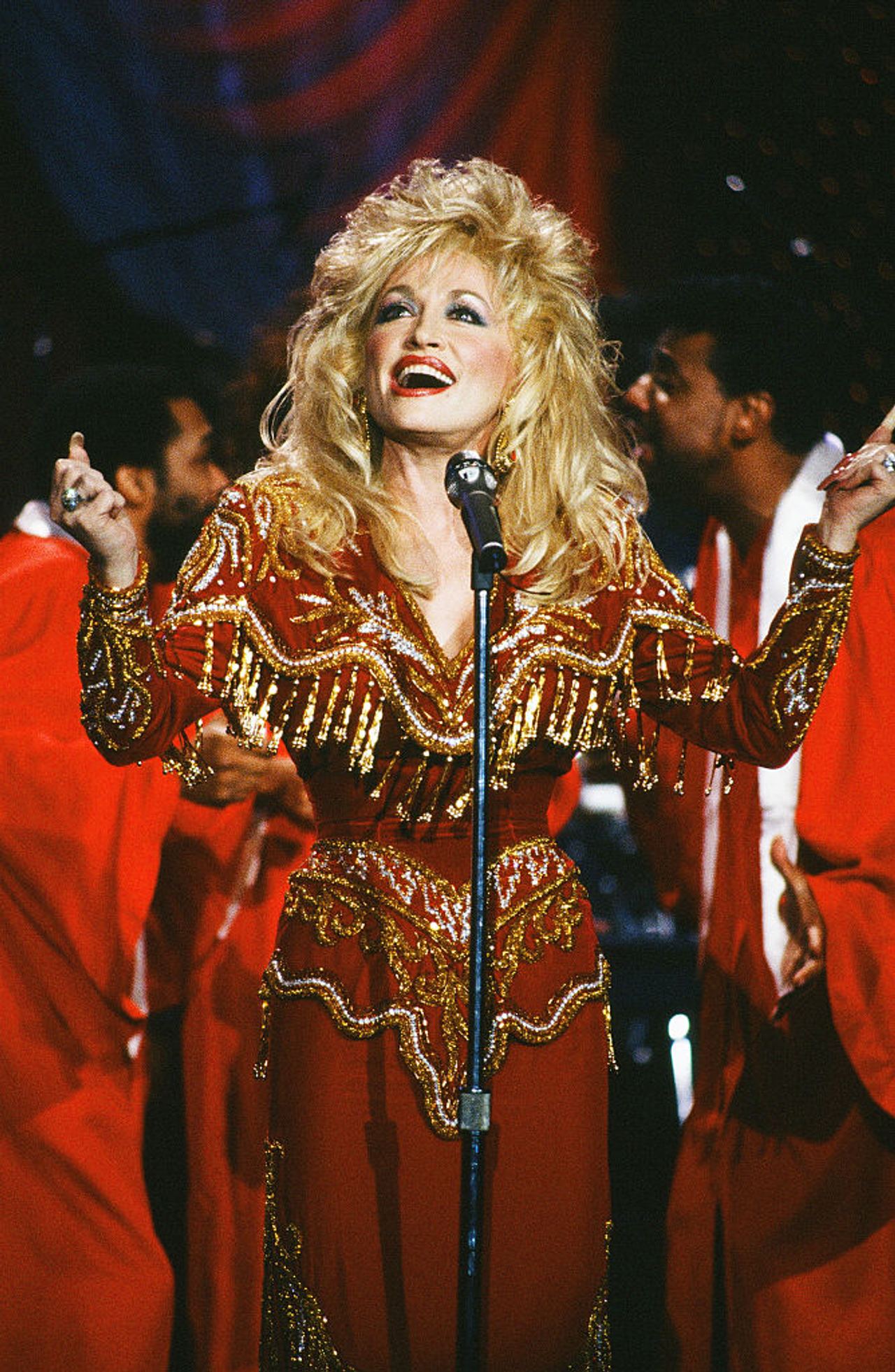 Parton's influence reached far beyond country music, with Barack Obama crediting her for a life that combined entertainment, business, literacy, and philanthropy. He said it was "hard to imagine many people having a bigger impact" than she did. | Source: Getty Images