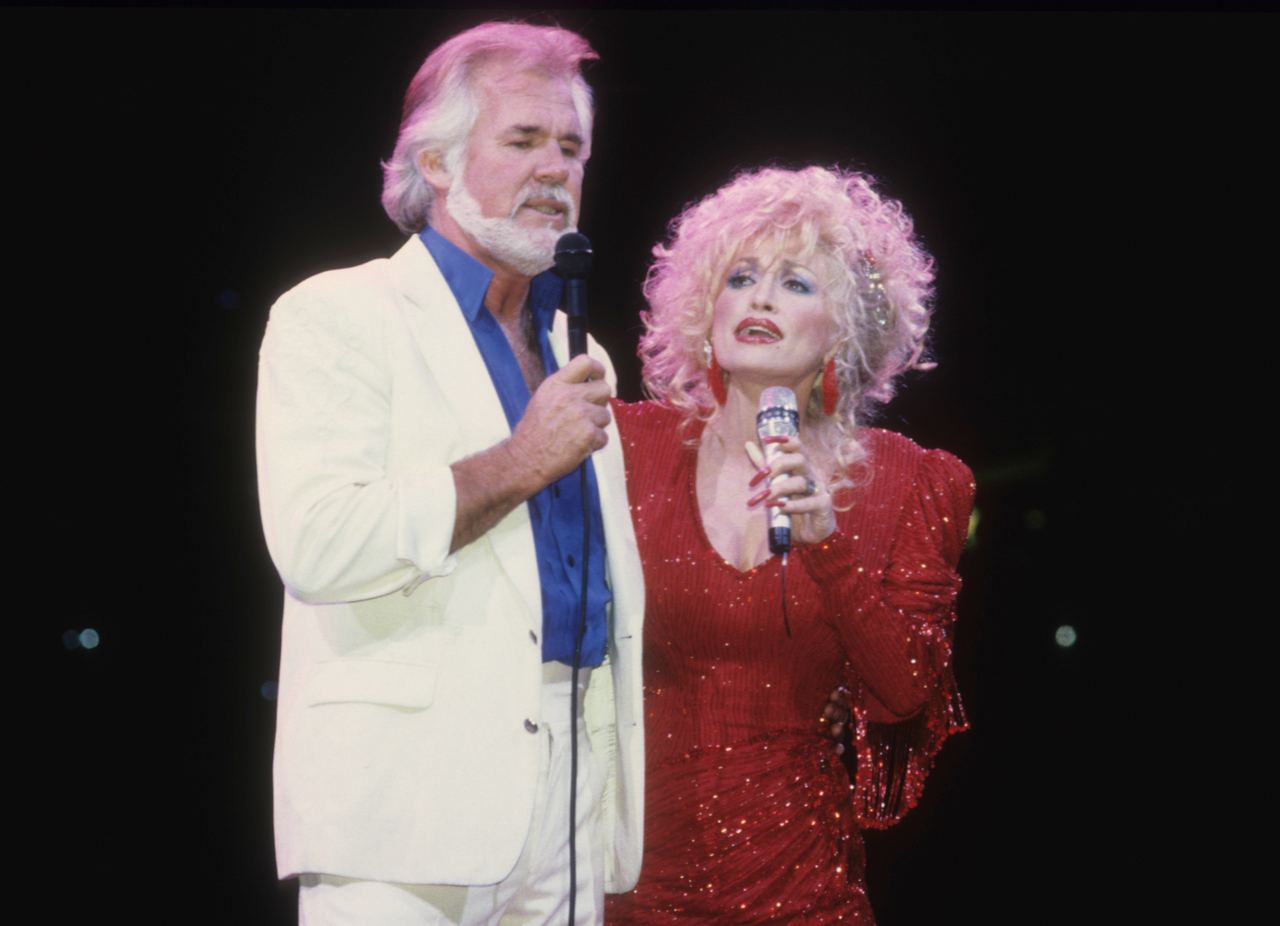 Dolly Parton and Kenny Rogers perform together onstage in 1990, reflecting the enduring friendship and musical partnership that kept them close for decades. | Source: Getty Images