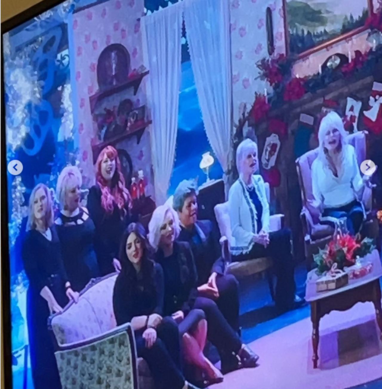 Dolly Parton appears alongside fellow performers in a scene from one of the projects she shared with her great-niece Lainey Mae Parton, whose memories of those experiences have taken on new meaning following her grandmother's death. | Source: Instagram/thelaineyparton