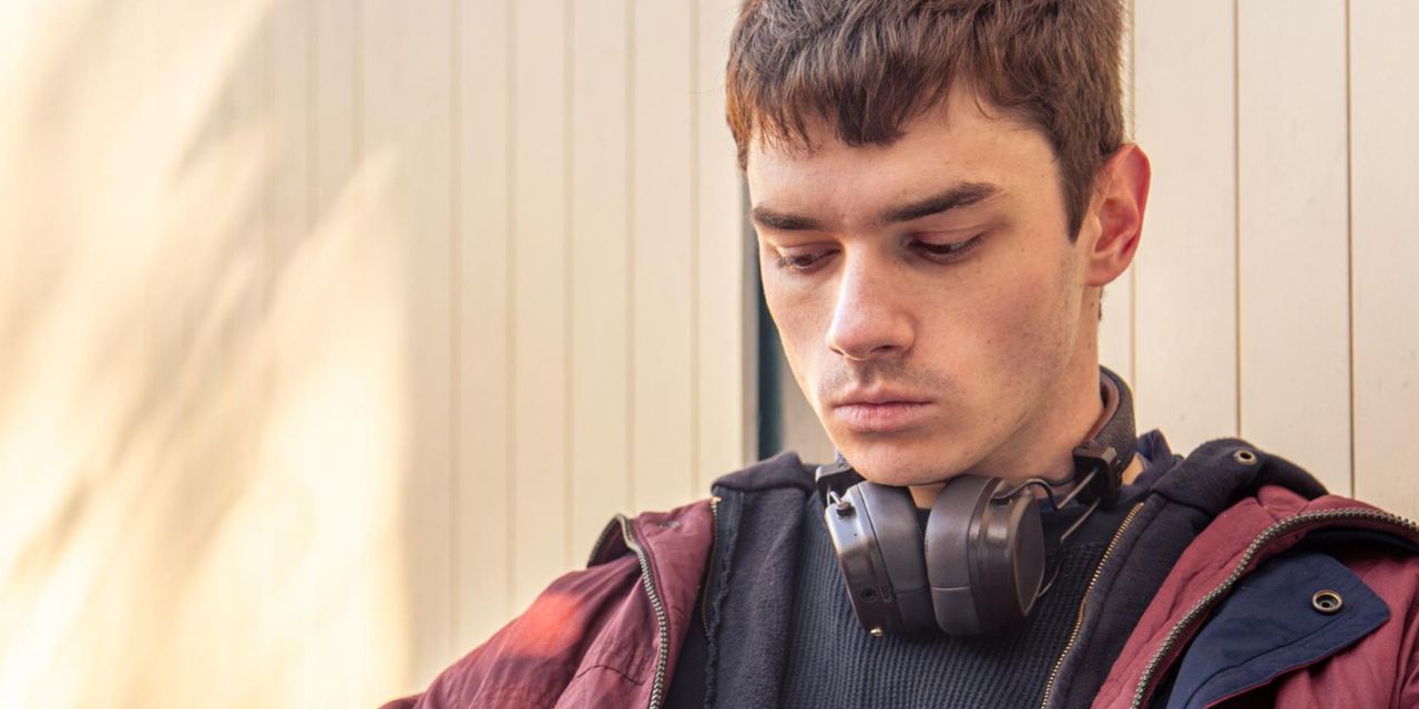 A young man lost in thought | Source: Freepik