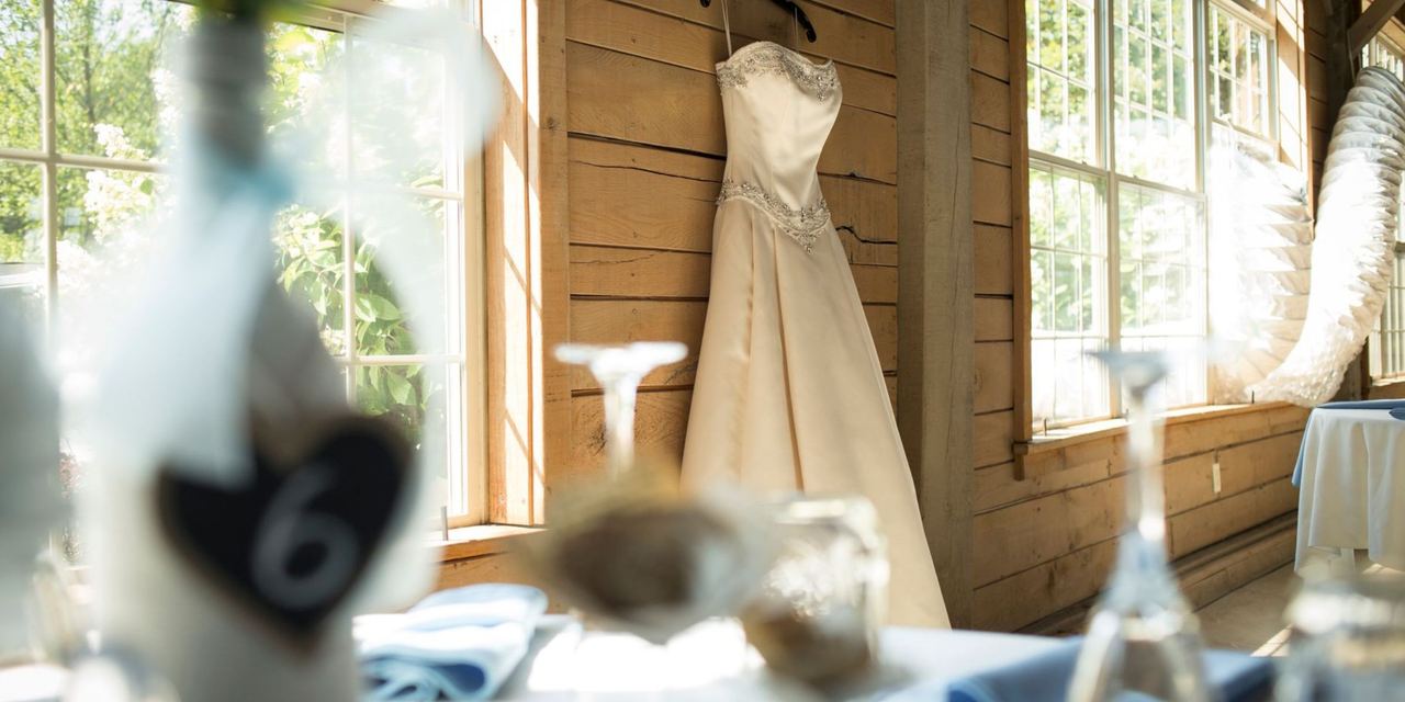 Wedding dress hanging inside a venue | Source: Pexels
