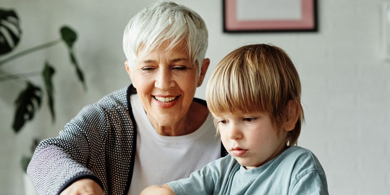 A child and his caregiver | Source: Shutterstock