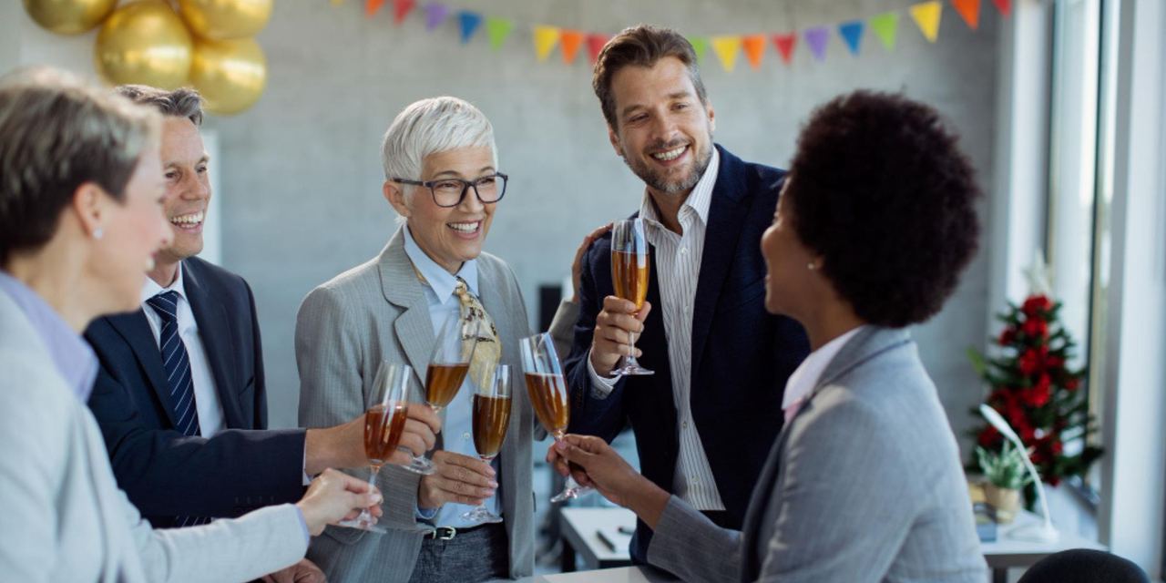 People toasting at a party | Source: Freepik