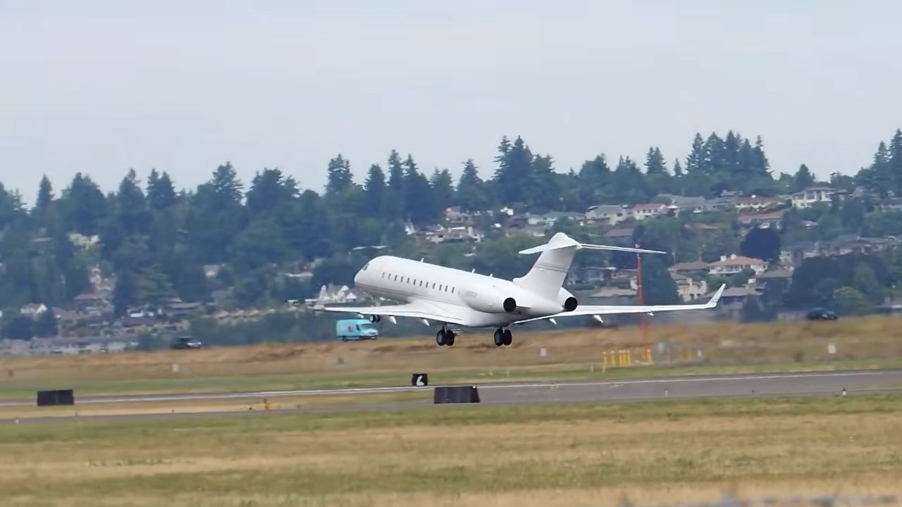 A private jet ascends into the sky during takeoff over a tree-lined landscape. | Source: YouTube/@WorldOfLuxuryOfficial