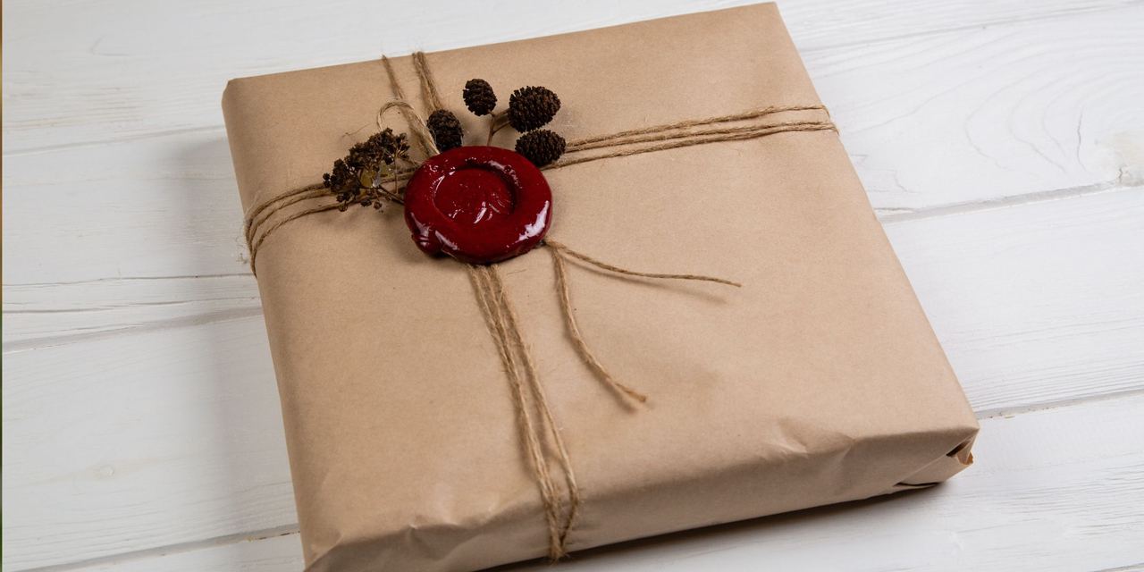 Vintage Christmas gift wrapped in craft paper | Source: Shutterstock