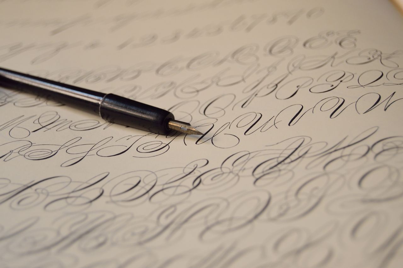 A fountain pen on a page of writing | Source: Pexels