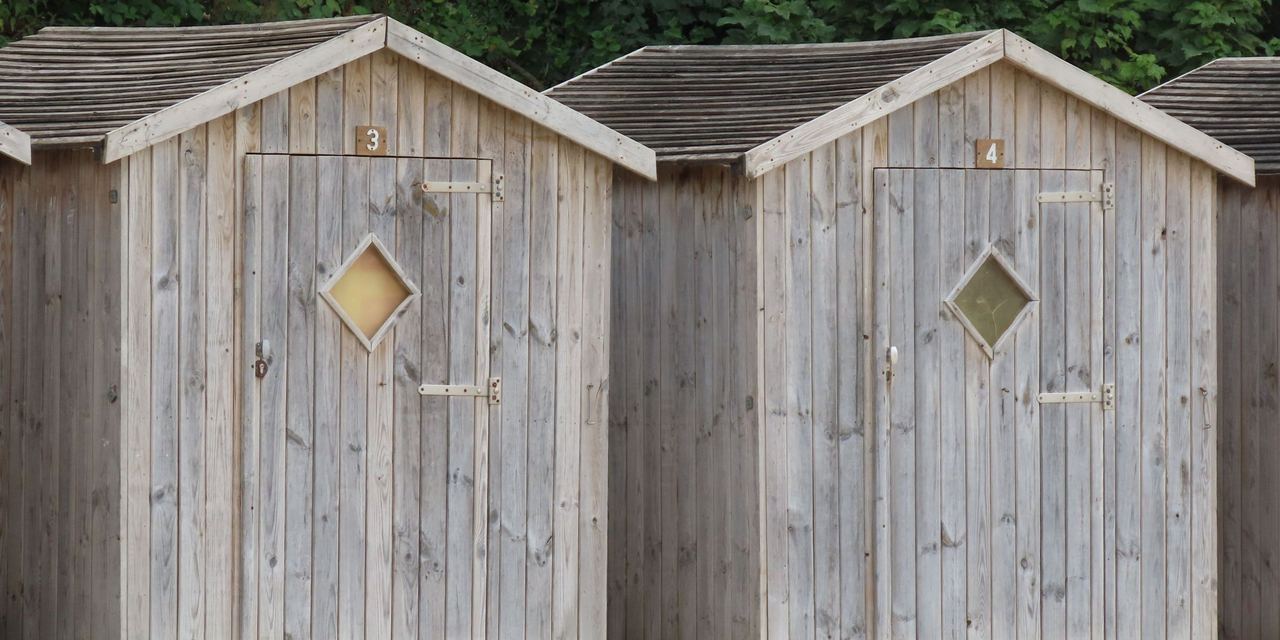 Wooden sheds on a beach | Source: Pexels