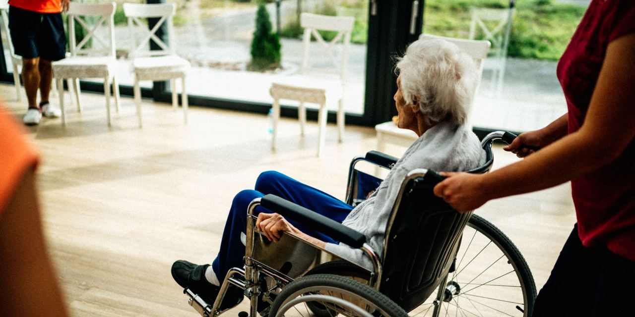 Someone pushing an elderly woman on a wheelchair | Source: Pexels