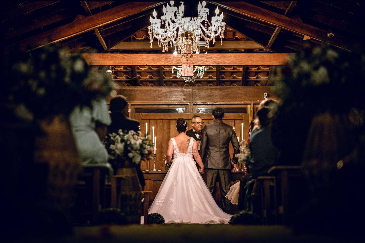 A back view of a bride and groom exchanging vows at the altar | Source: Pexels