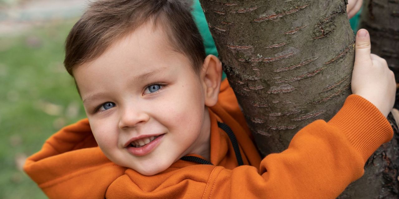A cheerful young boy | Source: Freepik