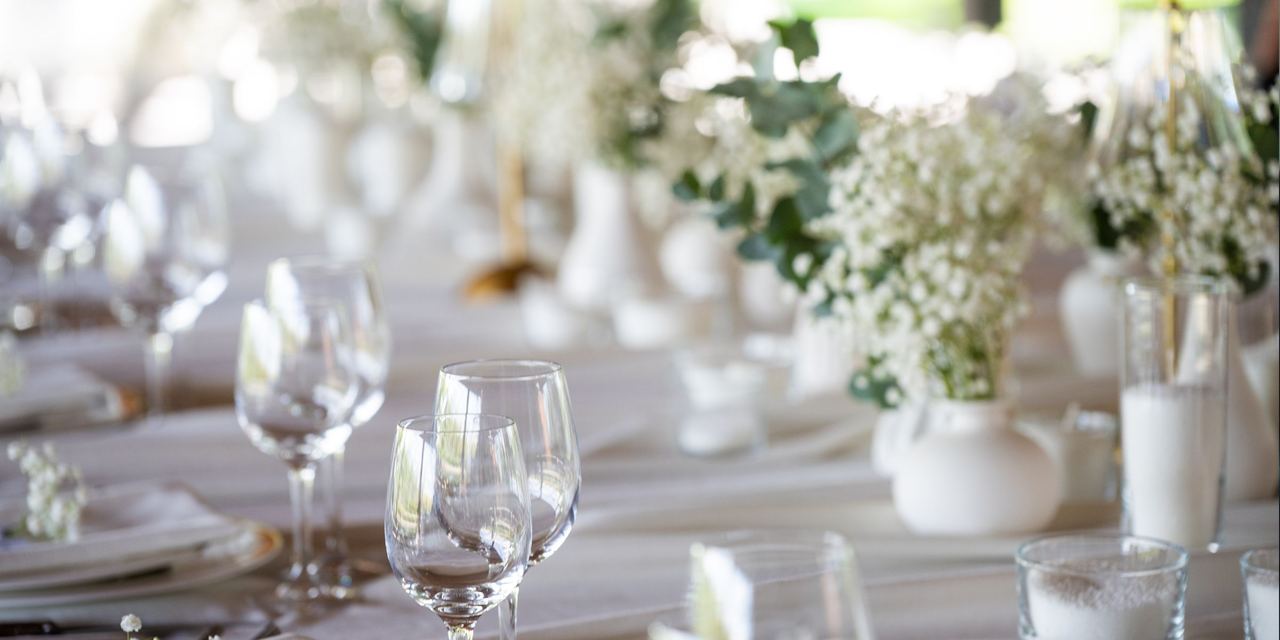 Beautiful table setting with flowers and cutlery | Source: Shutterstock