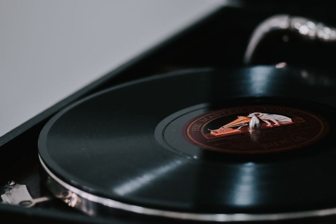 A close-up look at a vintage vinyl record spinning on a classic turntable.