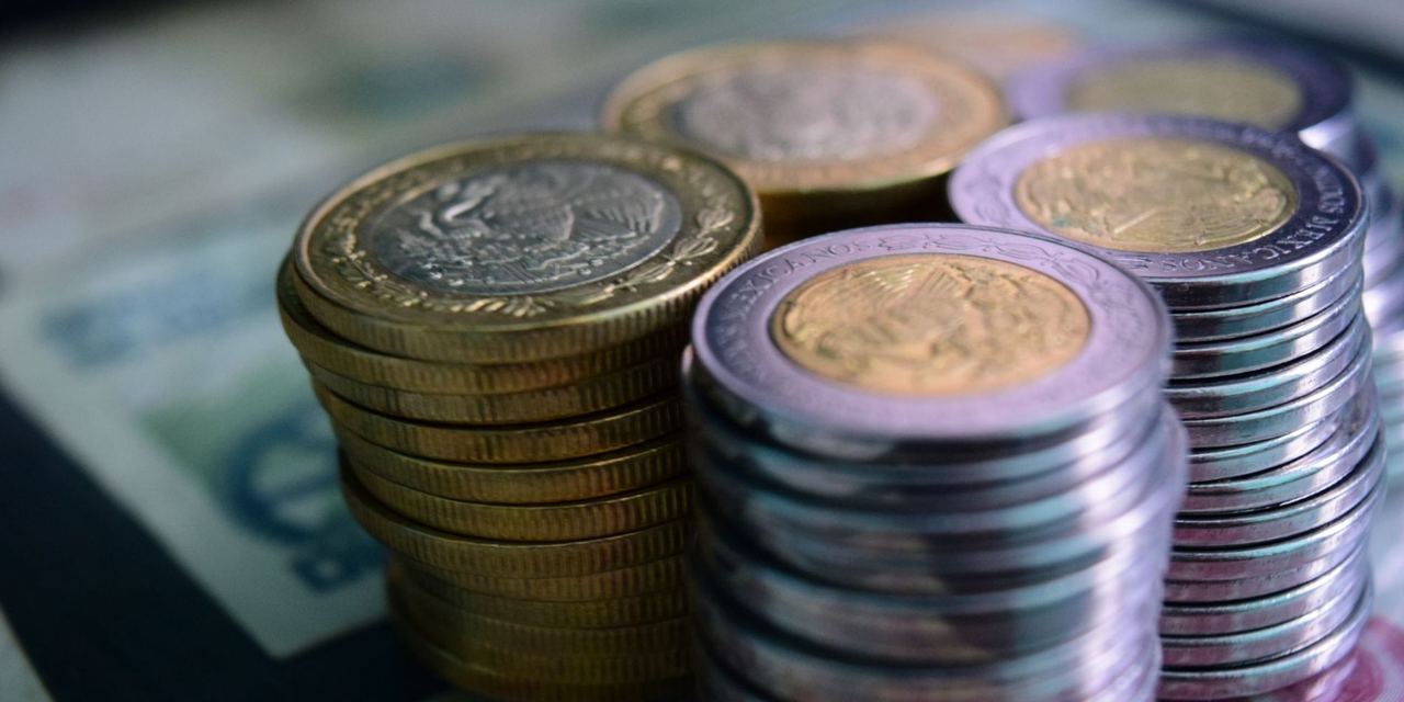 Stacks of coins arranged on top of paper currency, symbolizing savings, wealth, and financial growth | Source: Pexels