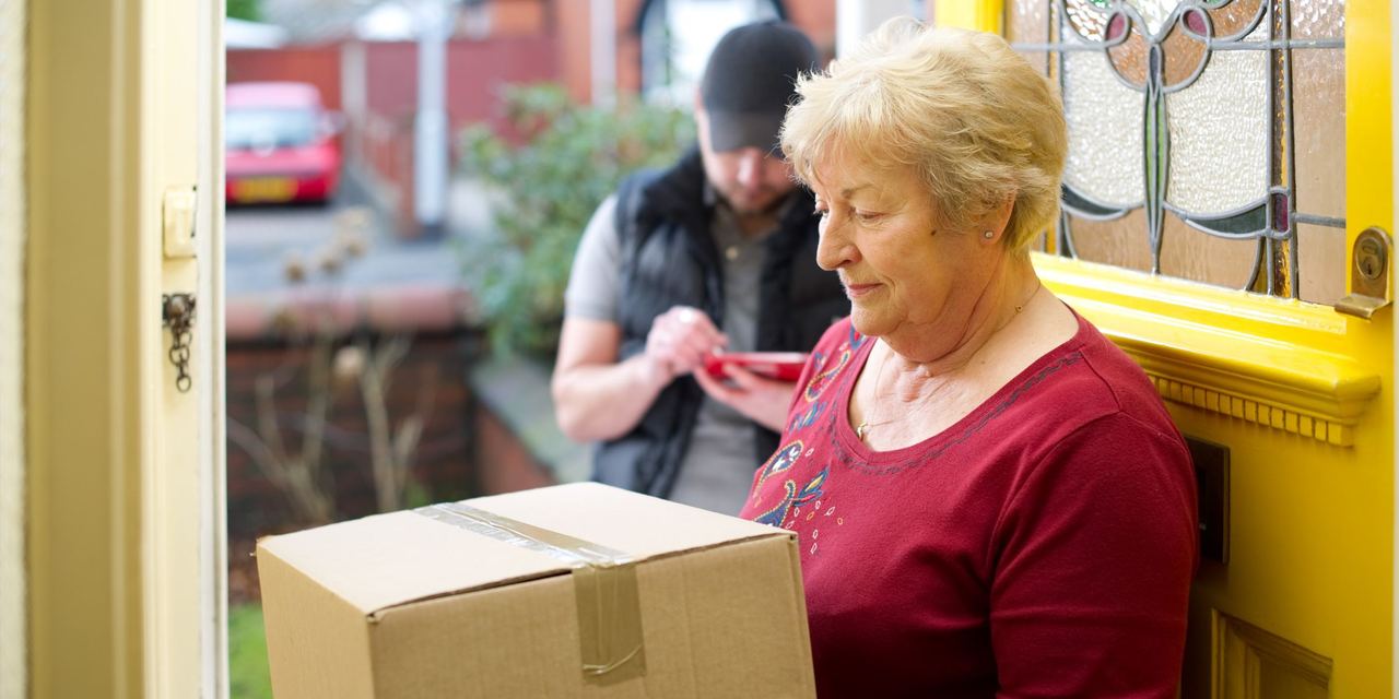 Delivery man delivers grandma's parcel | Source: Getty Images
