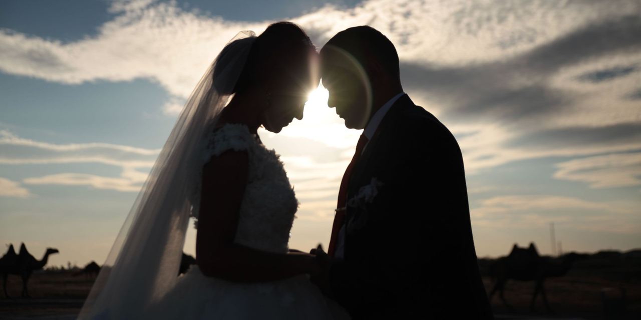 A couple hugging during a wedding ceremony | Source: Pexels