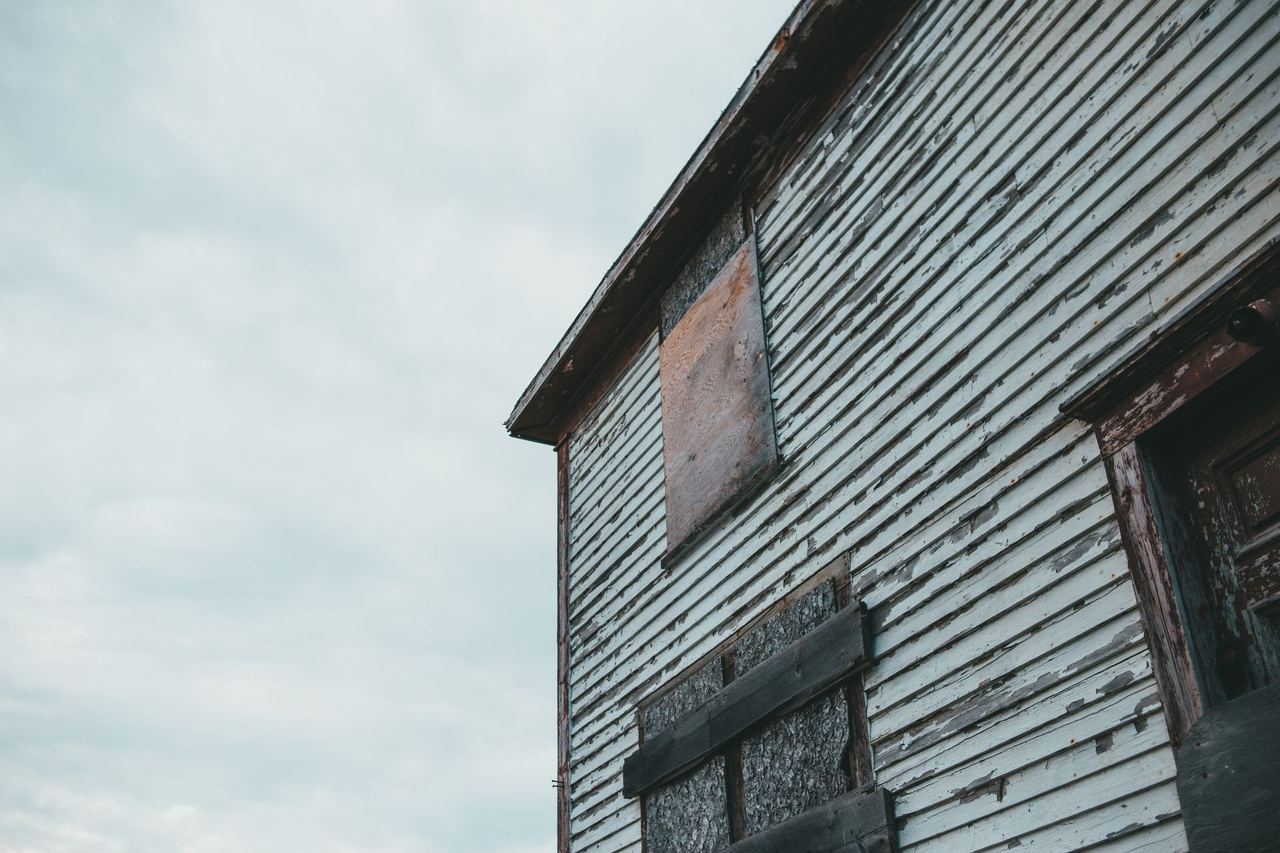 A house with boarded up windows | Source: Pexels