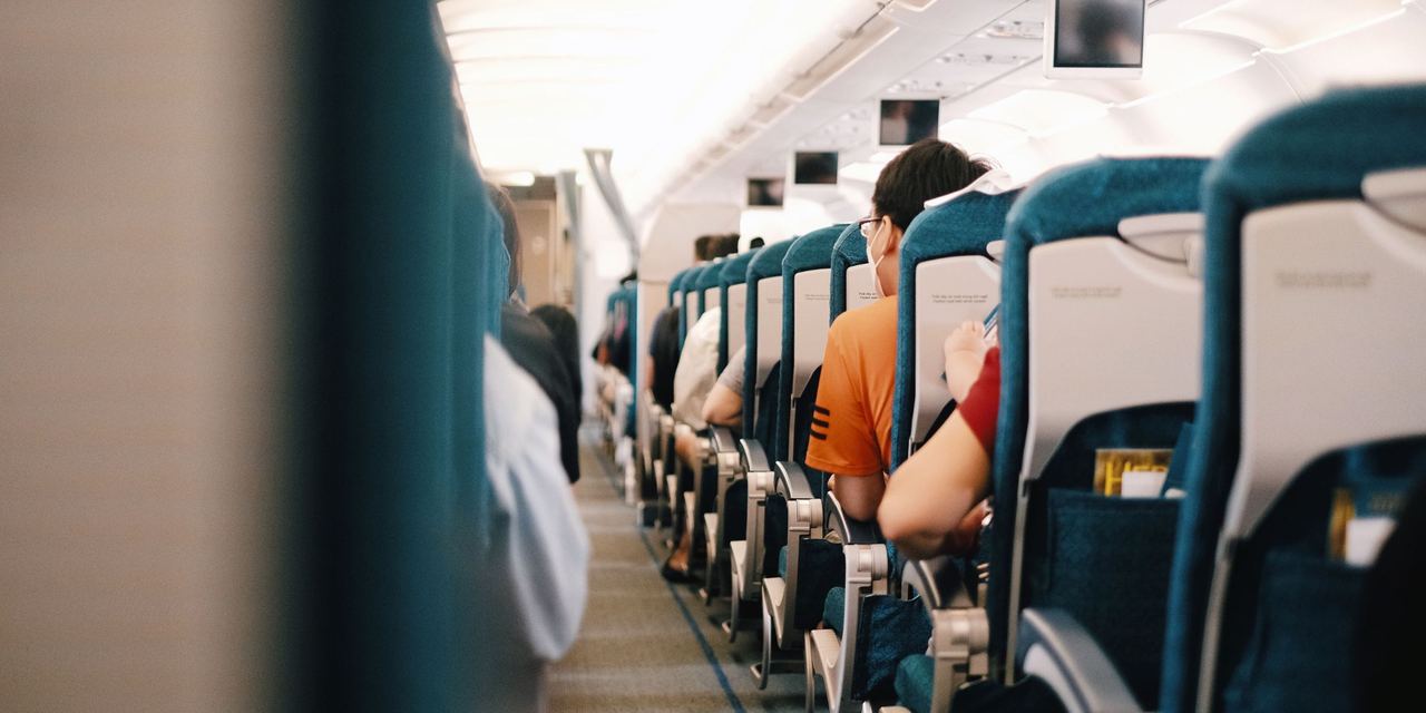 Interior view of passengers seated during a flight | Source: Pexels