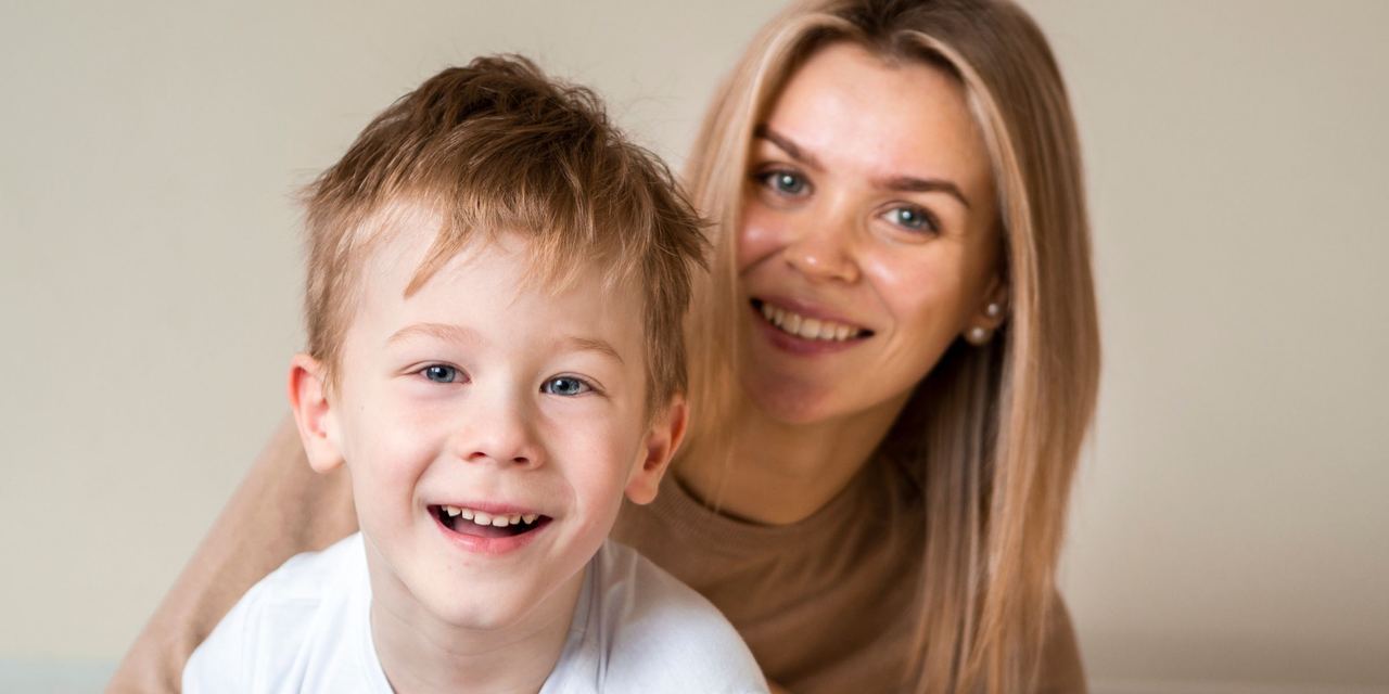 A smiling mother and son | Source: Freepik