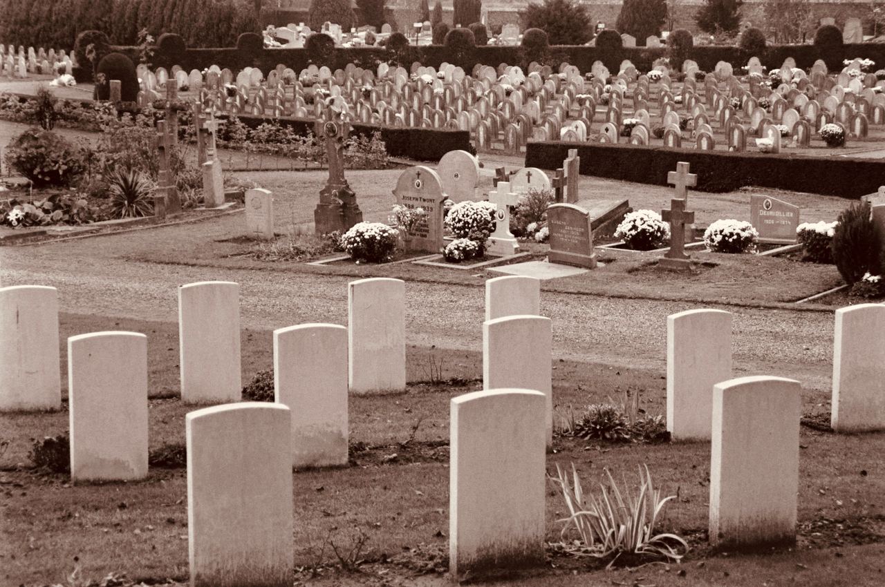 Sepia cemetery with rows of gravestones and monuments | Source: Pexels