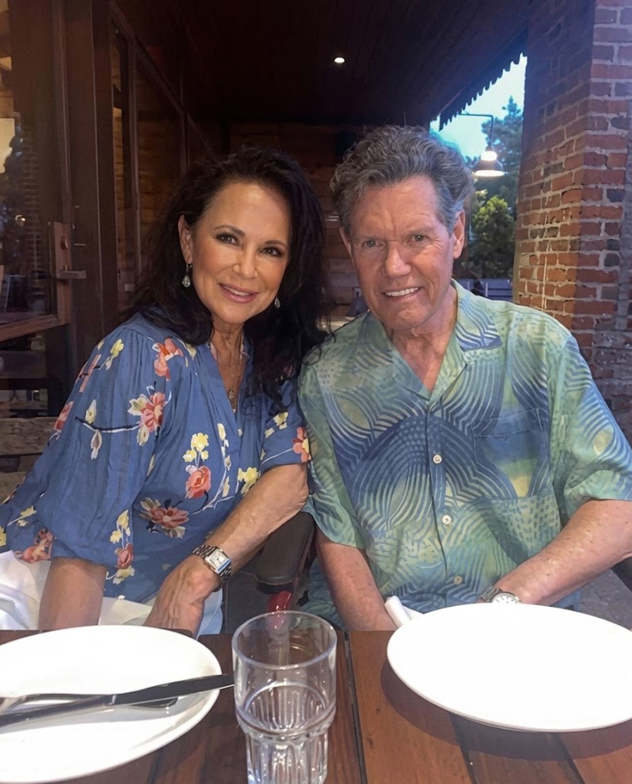 Randy Travis spent decades filling arenas with his baritone voice, but his life was saved by a single squeeze of a hand 