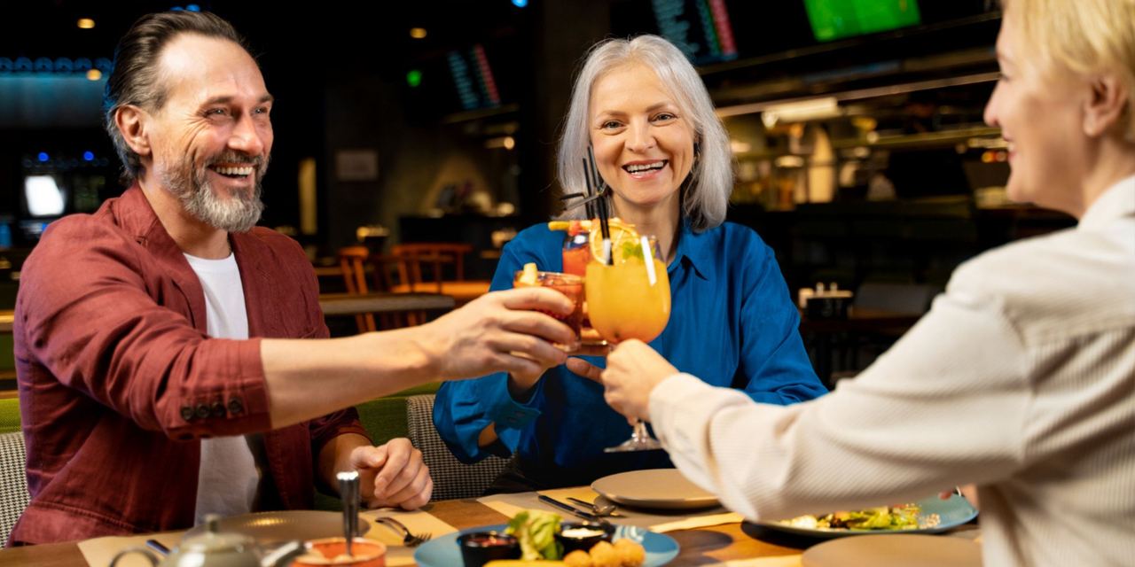 People celebrating together at a restaurant | Source: Magnific