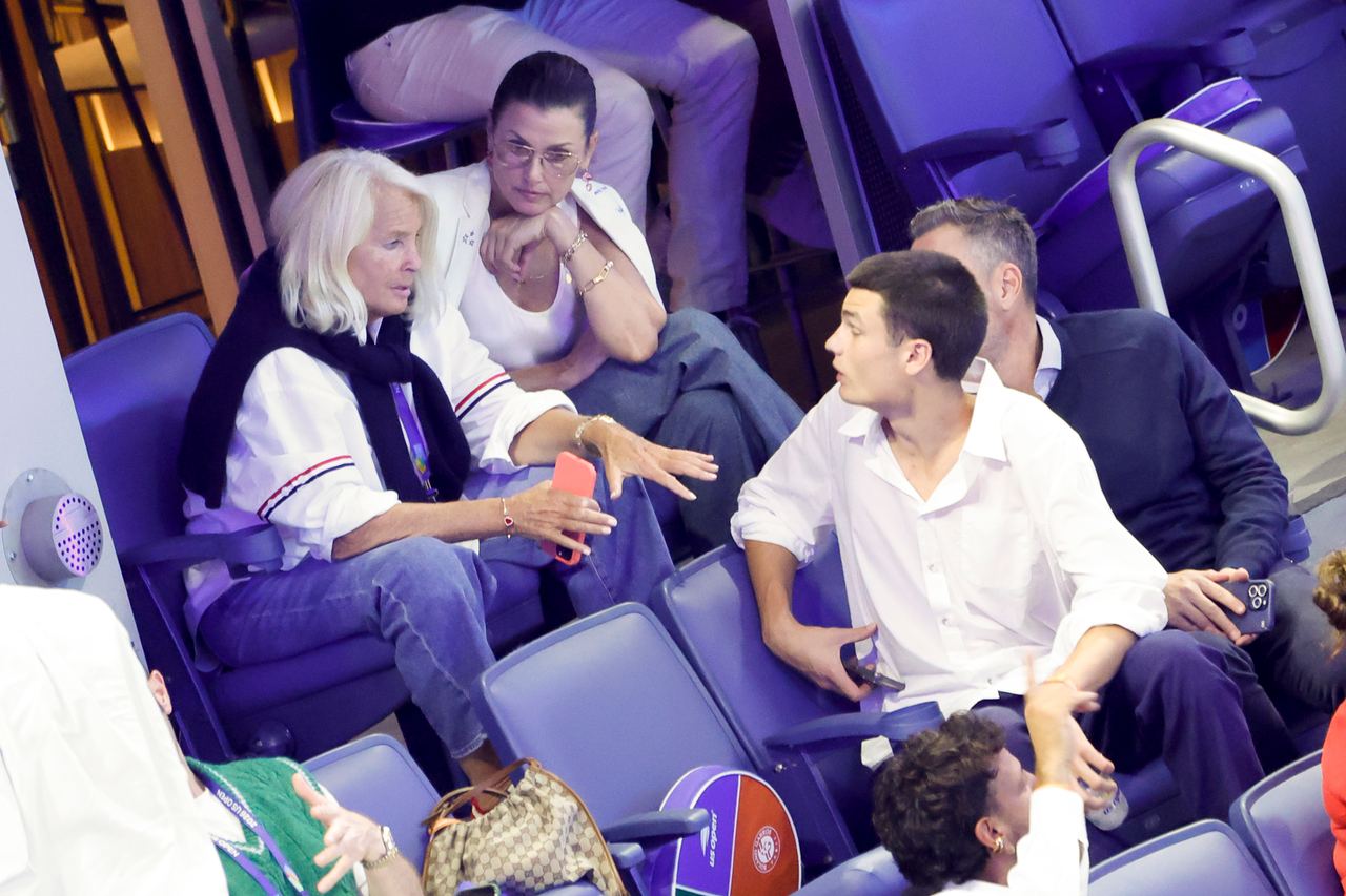 Bridget Moynahan and her son Jack sit together during the 2026 US Open on August 30, 2026, as they chat with fellow spectators in the stands. | Source: Getty Images