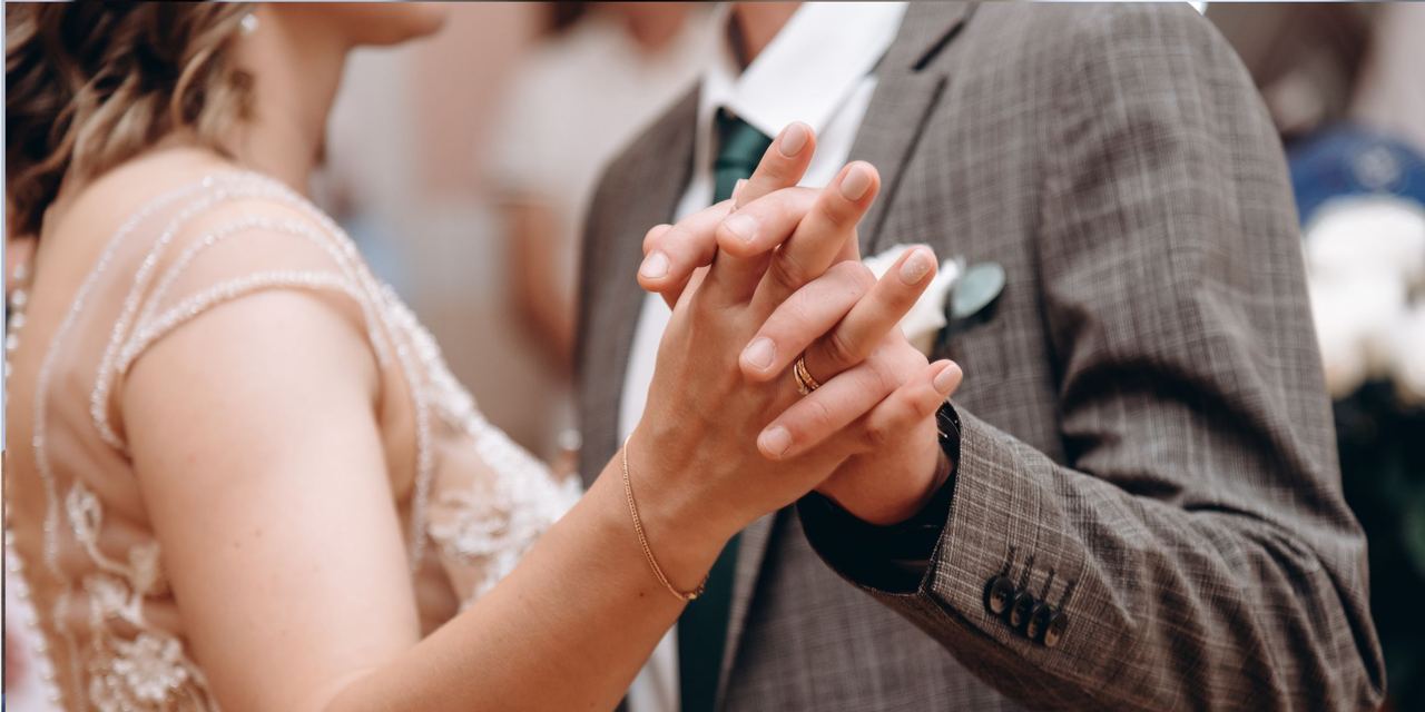 Close-up shot of a bride and groom dancing at a wedding ceremony | Source: Shutterstock