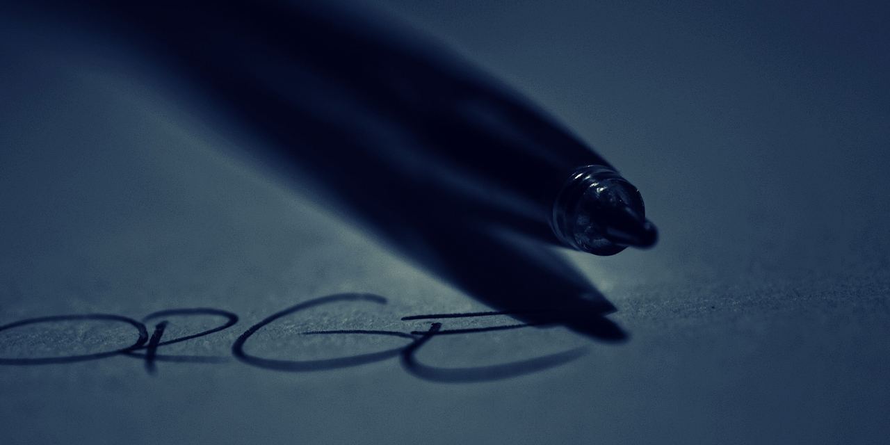 A pen over a signature | Source: Pexels