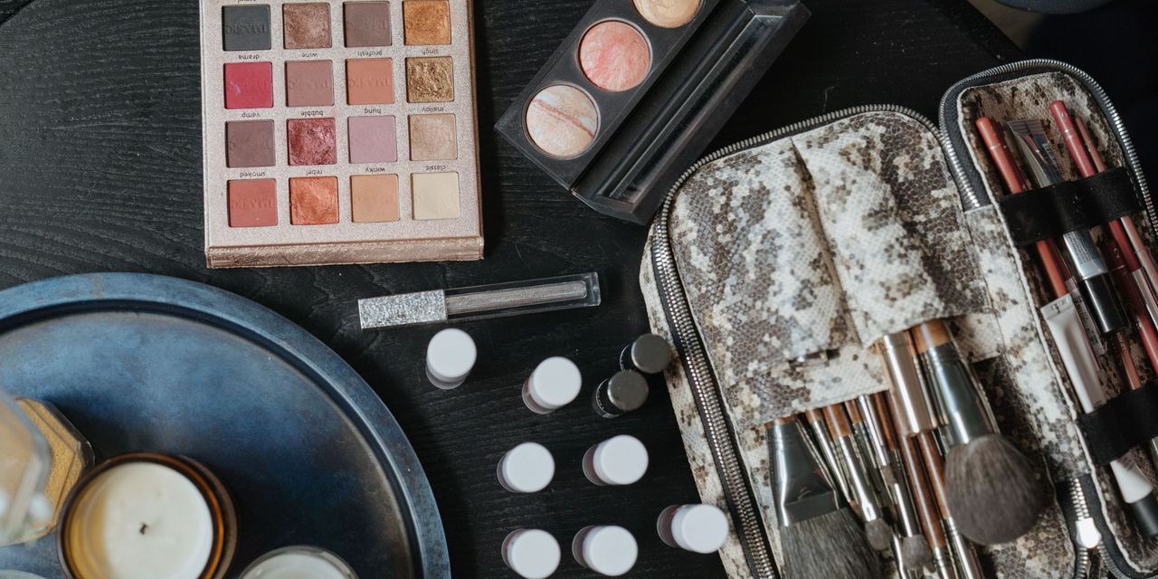 An aerial shot of cosmetics spread out on a surface | Source: Pexels