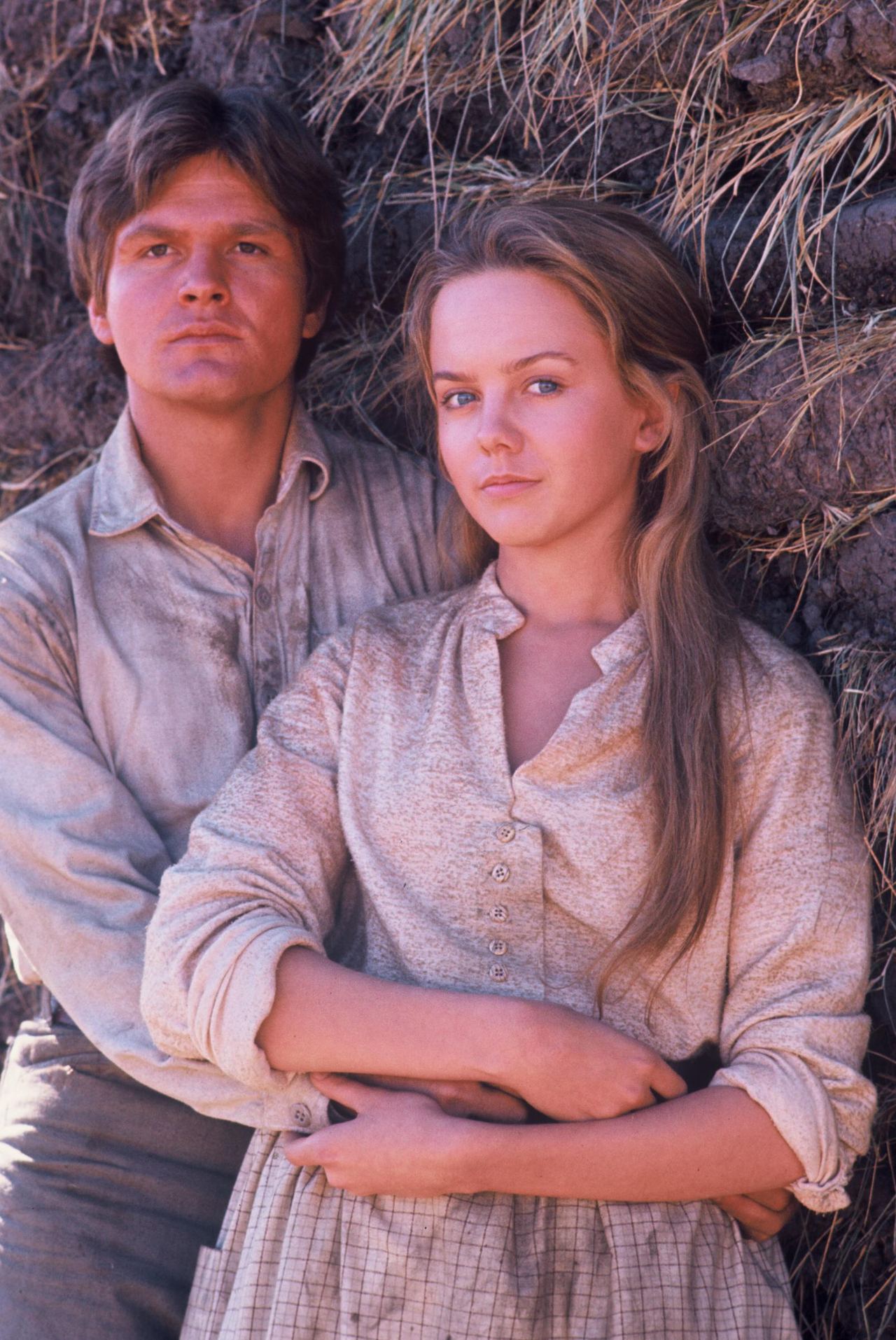 A simple calico blouse and plaid apron framed 20-year-old Linda Purl alongside co-star Roger Kern for the March 1, 1976 television movie "The Young Pioneers". Her full, baby-faced cheeks, soft jawline, and wide, innocent gaze epitomized the tender, unblemished youth of her early-career roles as she posed with sun-streaked brown hair swept over one shoulder. | Source: Getty Images