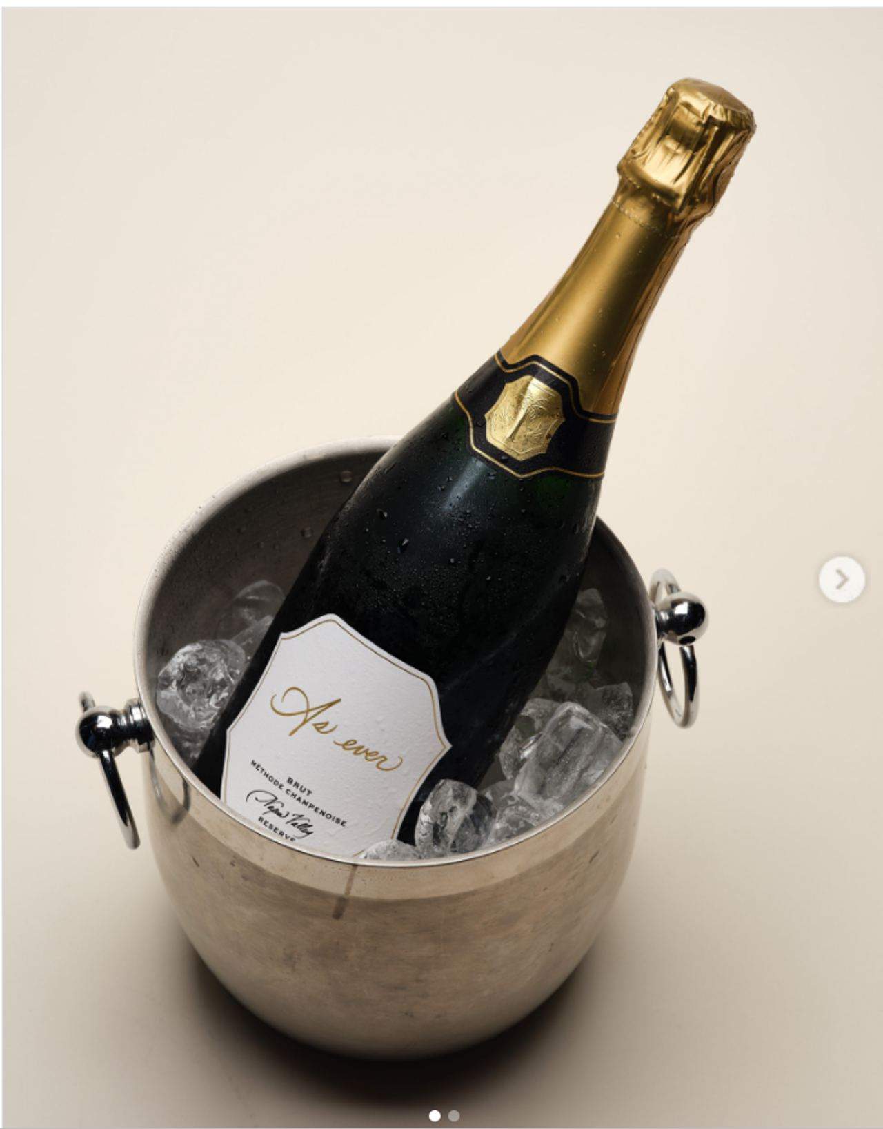 As Ever's Reserve Brut sparkling wine is pictured chilling in an ice bucket, with the brand's logo and Napa Valley designation visible on the bottle. | Source: Instagram/aseverofficial