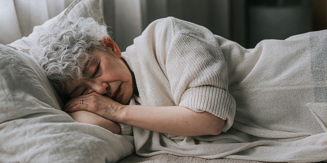 A woman lying on a bed | Source: Getty Images