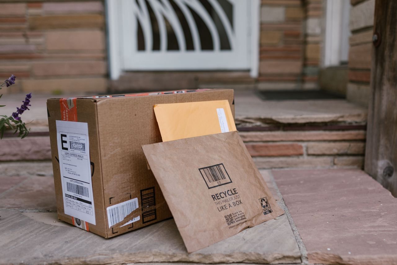 Close-up of delivered packages on doorstep | Source: Pexels