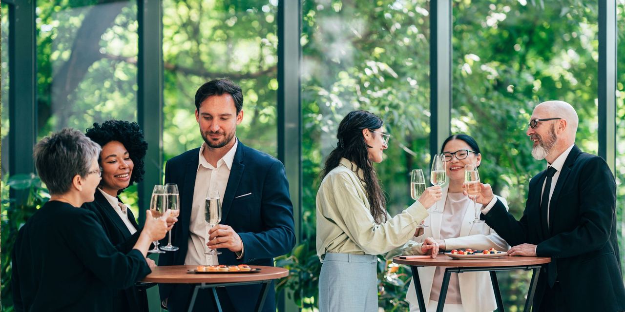 Business people at a corporate party | Source: Shutterstock