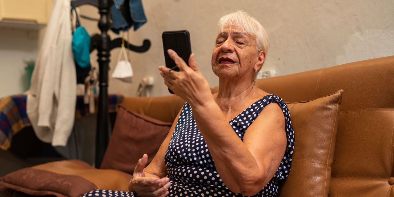 Grandma uses her cell phone while at home | Source: Getty Images