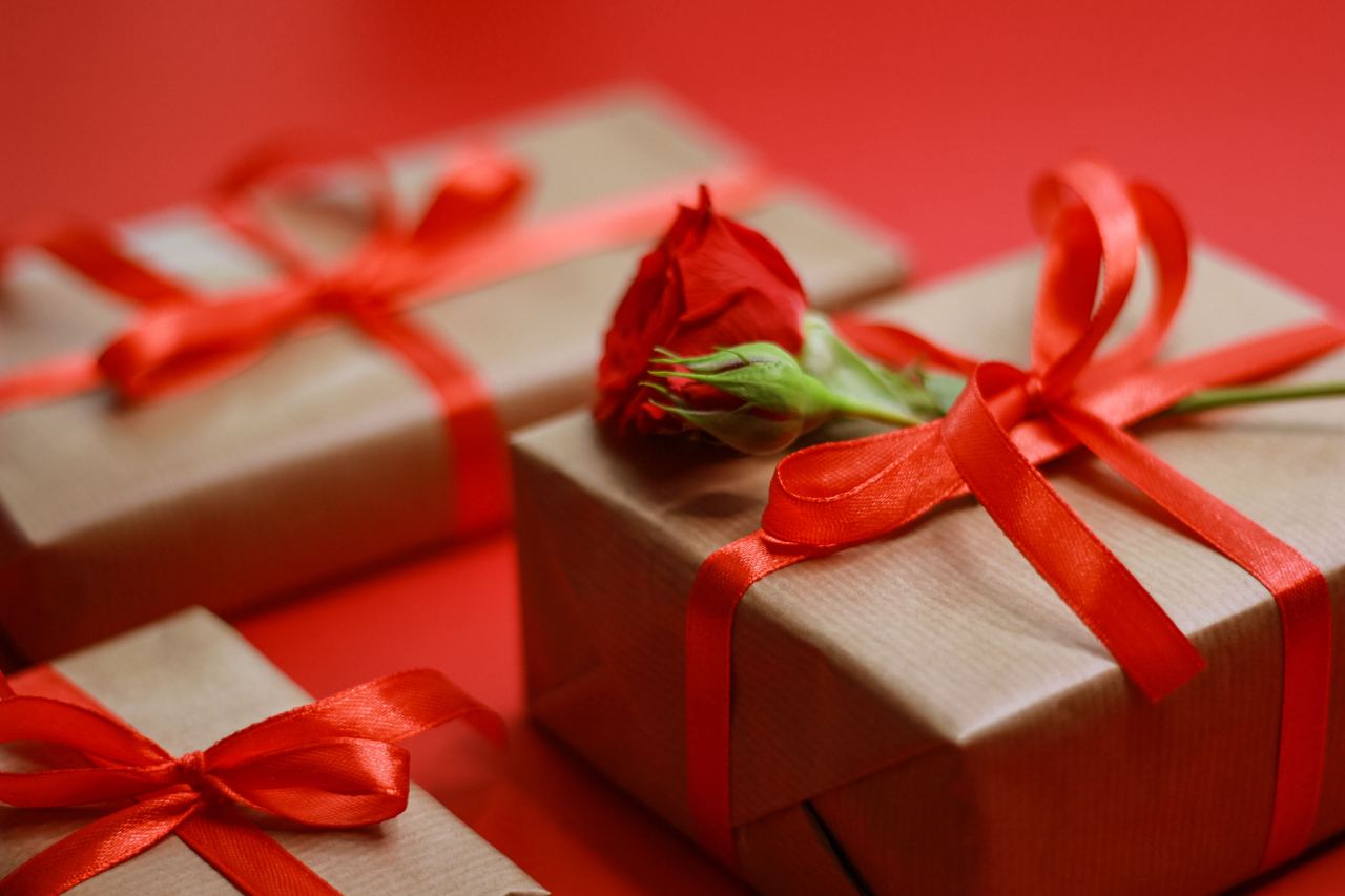 Gift boxes wrapped with red ribbons | Source: Pexels
