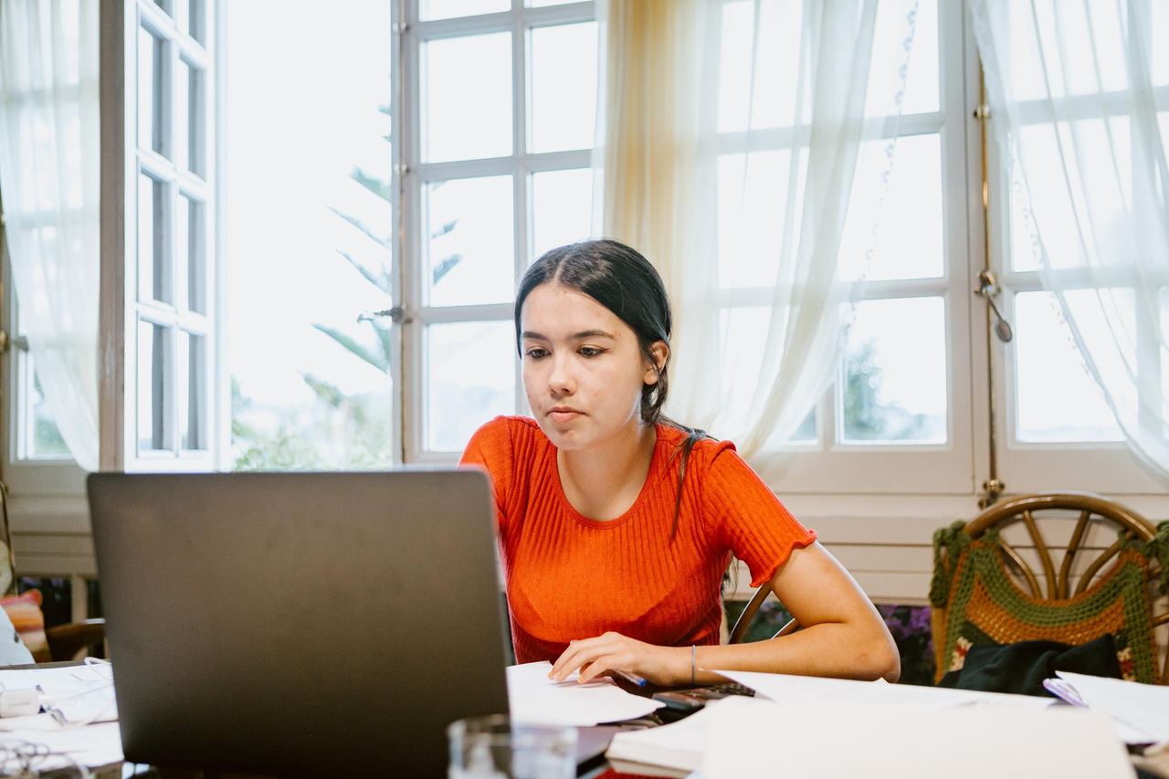A young lady using her laptop | Source: Getty Images