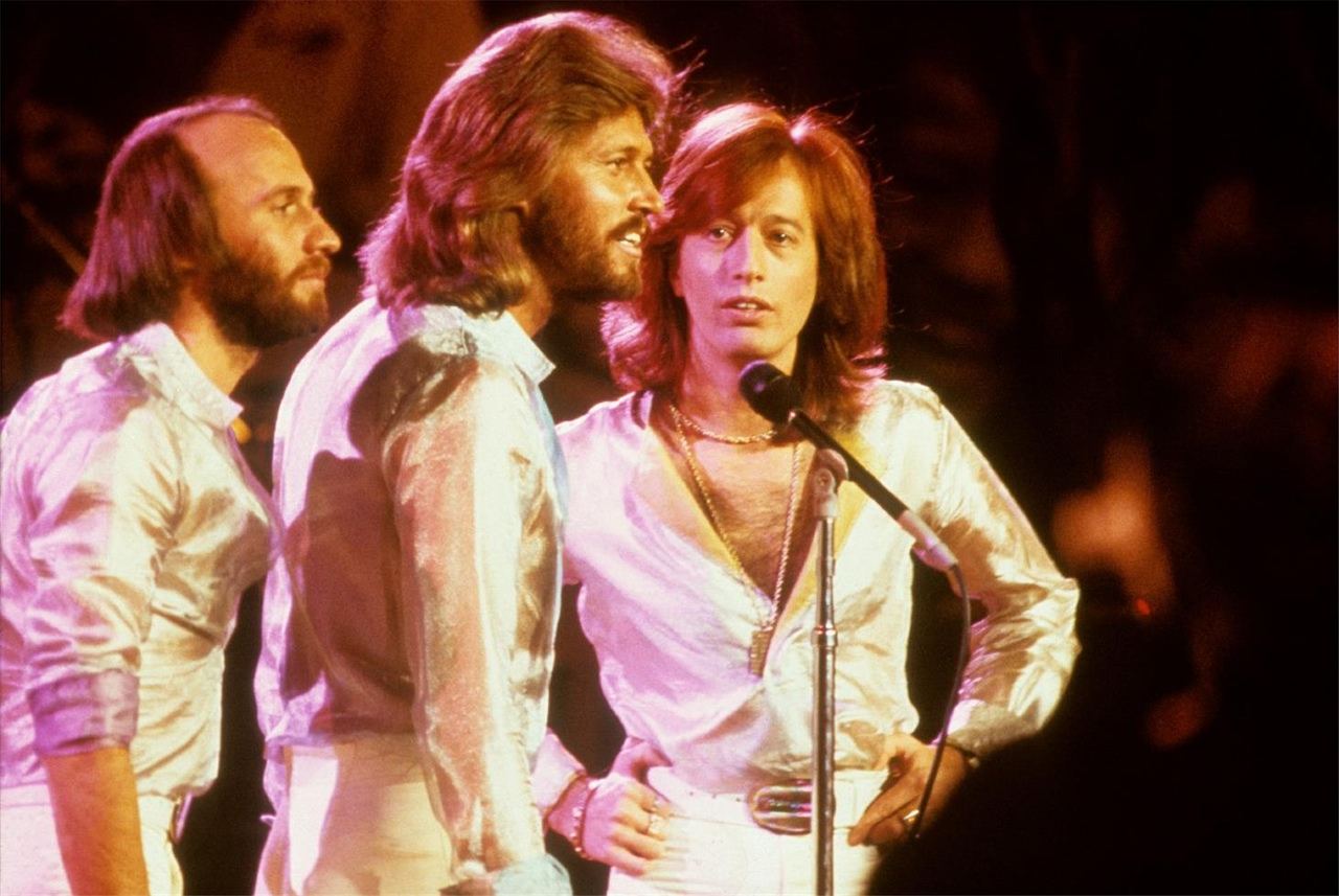 The Bee Gees performing together in 1979. Photo: Richard E. Aaron / Morrison Hotel Gallery. Illustrative concert photograph, not the recording session.