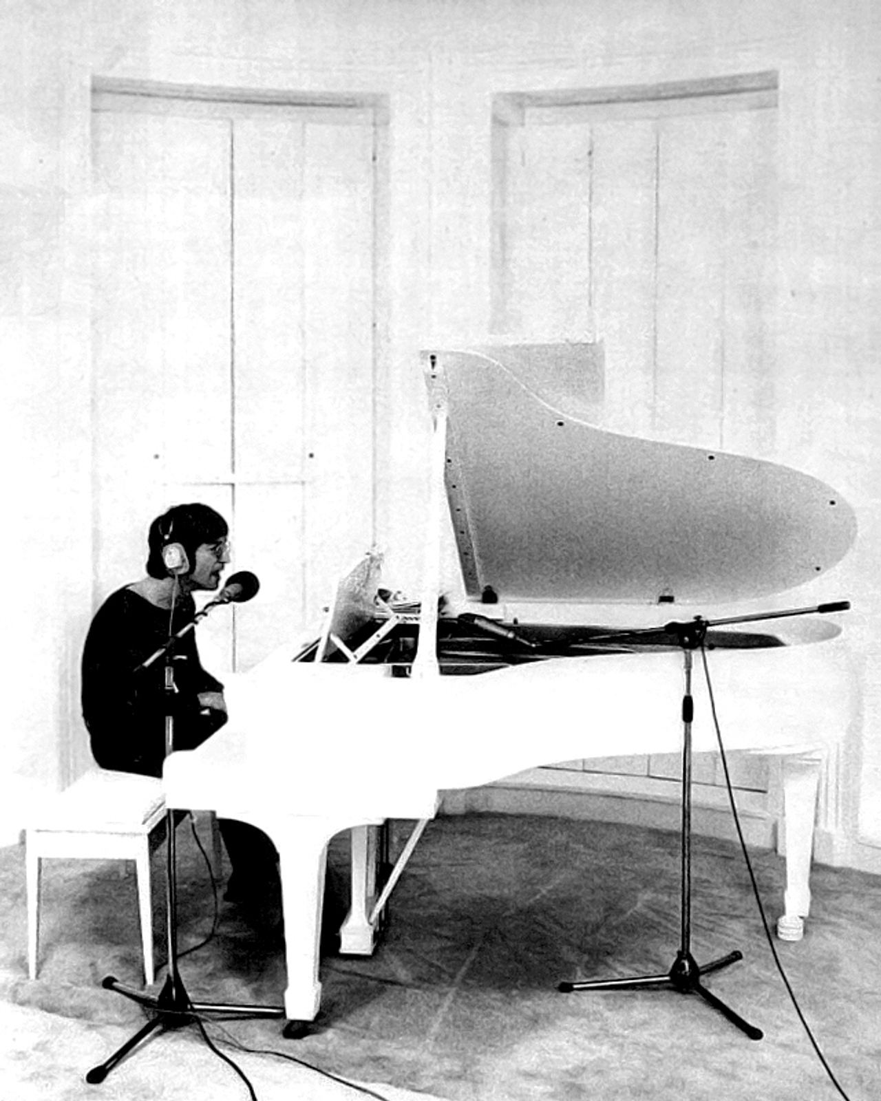 John Lennon at a white piano in an image used to promote Imagine in 1971