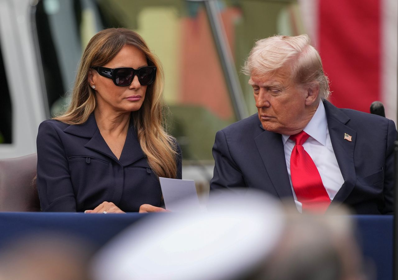 President Donald Trump and first lady Melania Trump read a note handed to them as they attend an observance event in the courtyard of the Pentagon on September 11, 2025 in Arlington, Virginia | Source: Getty Images