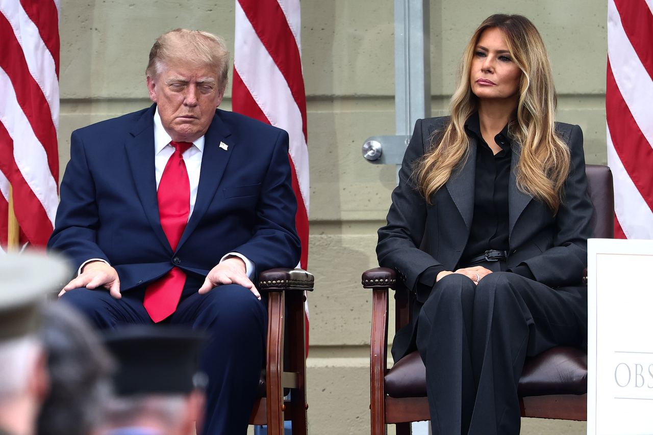 President Donald Trump and first lady Melania Trump look on during a ceremony commemorating the 25th anniversary of the September 11th terrorist attacks in the courtyard of the Pentagon. | Source: Getty Images