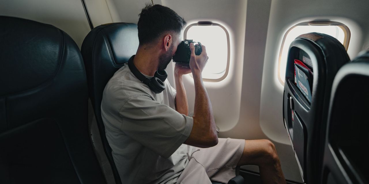 A man talking photos from an airplane | Source: Pexels