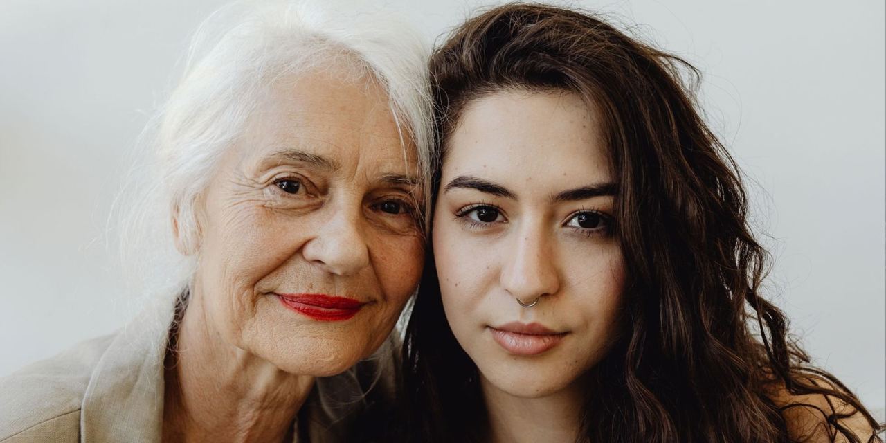 Grandmother and granddaughter sharing a loving moment | Source: Pexels
