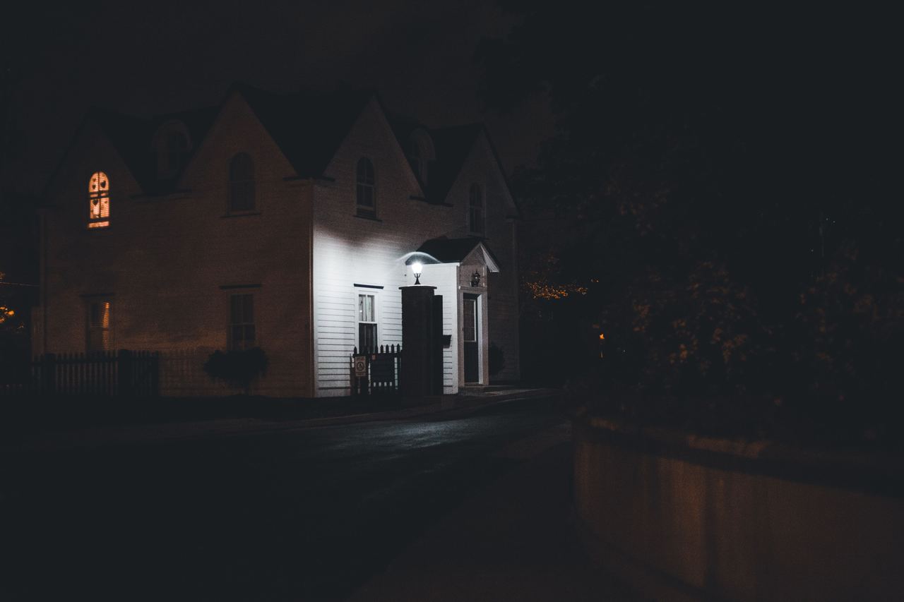 A house softly lit by outside lights | Source: Pexels
