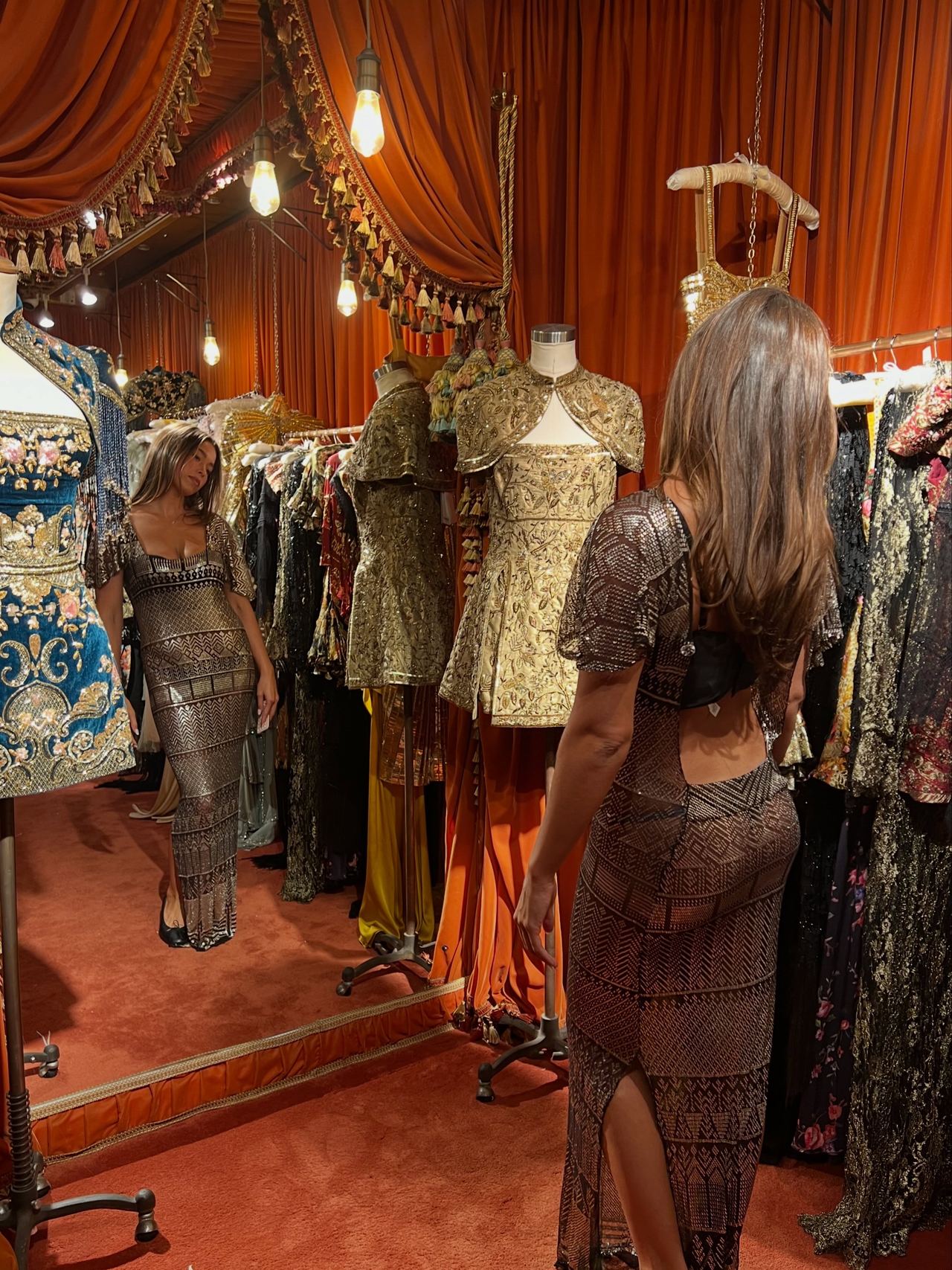 The fashion moment at the heart of Lola's carousel came when she tried on the sheer 1920s Egyptian gown at Annie's Ibiza, admiring the floor-length vintage piece in the mirror. | Source: Instagram/theyoungestyung