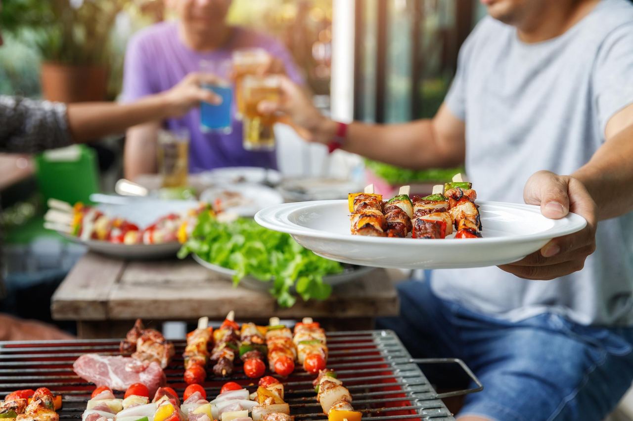 People at a barbecue party | Source: Shutterstock