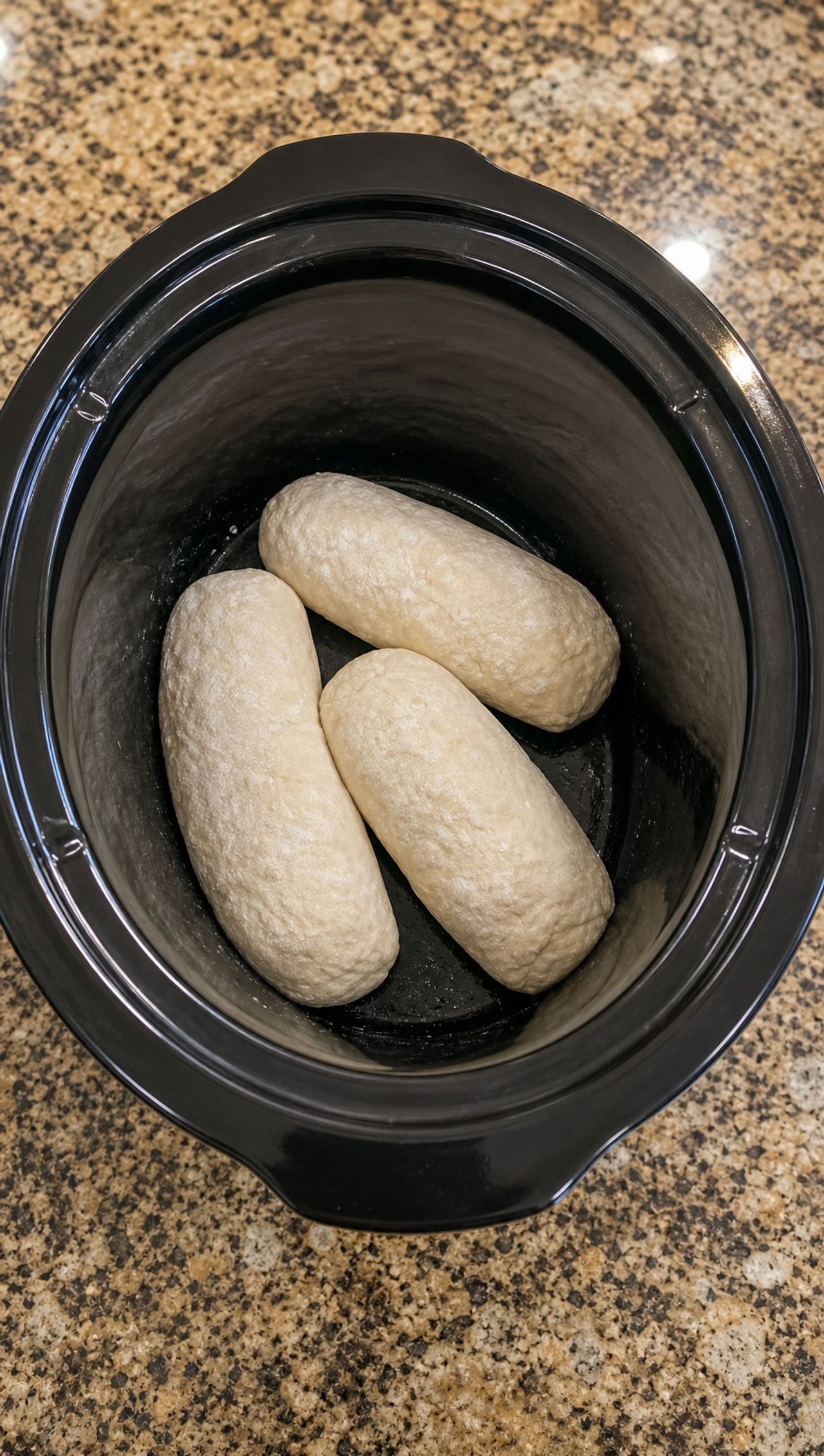 Place frozen raw bread dough loaves into the crock pot with 3 other secret ingredients to