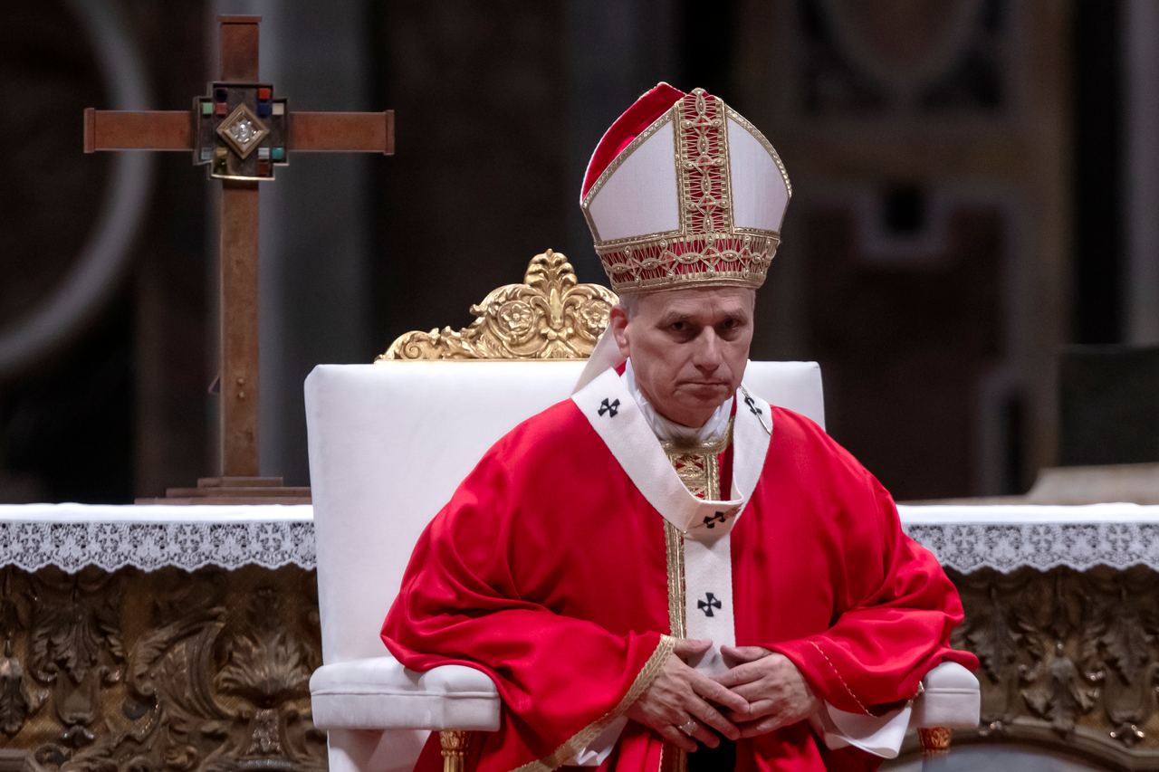 Pope Leo XIV sits in ceremonial red and white vestments during an event at the Vatican on October 8, 2026. The first American pope, elected in 2025, is preparing for a November 6–17 trip to Uruguay, Argentina, and Peru, although questions have emerged about whether his upcoming surgery could affect the itinerary. | Source: Getty Images